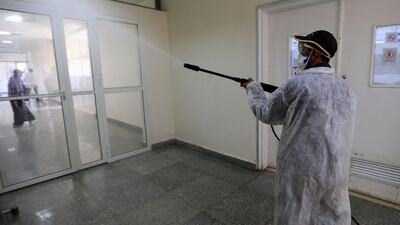 A man sprays disinfectant at the Central Health Laboratory in the Yemeni capital Sanaa. AFP