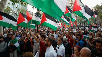 Supporters wave flags at a pro-Palestinian protest in Barcelona, Spain. Reuters