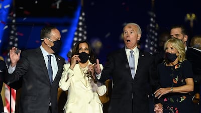 US President-elect Joe Biden and Vice President-elect Kamala Harris react as confetti falls, with Jill Biden and Douglas Emhoff, after delivering remarks in Wilmington, Delaware. AFP