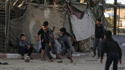 Palestinian children play football at a refugee camp in Khan Yunis in the southern Gaza Strip. AFP