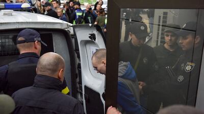 Russian serviceman Vadim Shishimarin, centre, leaves a court hearing in Kyiv. EPA